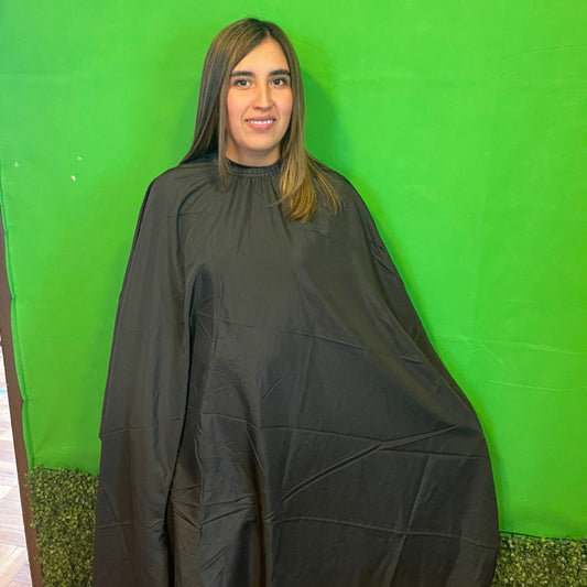 Capa de corte de cabello antifluido